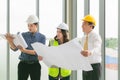 Two mans inspectors and architects discuss with head engineer about construction project Royalty Free Stock Photo