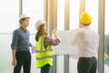 Two mans inspectors and architects discuss with head engineer about construction project