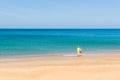 Two mans looking at the sea on the tropical beach, relaxed, concept of freedom