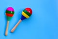 Two maracas on blue background Royalty Free Stock Photo