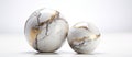 Two marble eggs displayed on white surface in still life photography