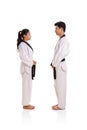 Two martial art practitioners facing each others, full body Royalty Free Stock Photo