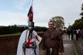 Two masked cosplay. One dressed as a crusader warrior and the other as a friar at the Lucca Comics & Games