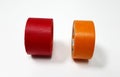 Two masking tapes roll red and orange isolated on white background. Royalty Free Stock Photo