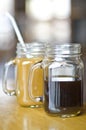 Two Mason jar coffees close up Royalty Free Stock Photo