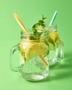 Two mason jars with a cold natural handmade cocktail with bubbles of air. Refreshing drink from natural ingredient -