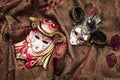 Two masquerade carnival masks on the fabric background Royalty Free Stock Photo