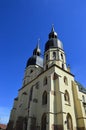 Two massive towers of gothic cathedral of Saint Nicholas in Trnava, western Slovakia, central Europe. Spring daylight sunshine Royalty Free Stock Photo