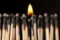 Two matches with a fire above them standing close to each other Royalty Free Stock Photo