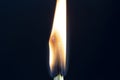 Two matchsticks burning side by side, black background. close-up. Royalty Free Stock Photo