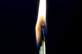 Two matchsticks burning side by side, black background. close-up. Royalty Free Stock Photo