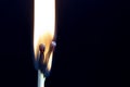 Two matchsticks burning side by side, black background. close-up. Royalty Free Stock Photo