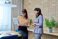 Two mature business women colleagues employees working together in office Royalty Free Stock Photo