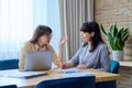 Two mature business women colleagues employees working together in office Royalty Free Stock Photo