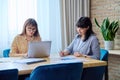 Two mature business women colleagues employees working together in office Royalty Free Stock Photo