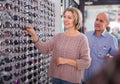 Two mature customers in glasses store Royalty Free Stock Photo