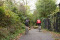 Two Mature Male Cyclists Riding Bikes Along Path Royalty Free Stock Photo