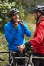 Two Mature Male Cyclists Riding Bikes Along Path Royalty Free Stock Photo