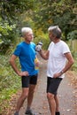 Two Mature Male Joggers Taking Break Whilst On Run