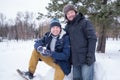 Two mature men father and son dressed in warm clothes sniling and looking at camera Royalty Free Stock Photo