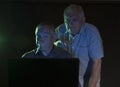 Two mature men looking at a computer screen Royalty Free Stock Photo