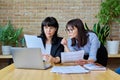 Two mature serious confident business women working together in office Royalty Free Stock Photo