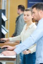 Two mature students working together using laptop Royalty Free Stock Photo