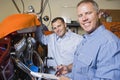 Two Mechanics At Work Royalty Free Stock Photo