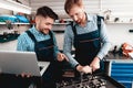 Two Mechanics Work Together On Service Station. Royalty Free Stock Photo