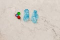 Two medical blue shoe covers in individual capsules with green\red colored caps. Disposable shoe covers. Protection concept.Copy Royalty Free Stock Photo