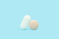 Two medical pills on a light blue background Royalty Free Stock Photo