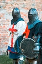 Two medieval knights in armor. With a cross Royalty Free Stock Photo