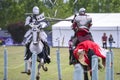 Two medieval knights confront during jousting tournament Royalty Free Stock Photo