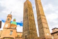 Two medieval towers of Bologna Le Due Torri: Asinelli and Garisenda and Chiesa di San Bartolomeo Gaetano church Royalty Free Stock Photo