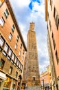 Two medieval towers of Bologna Le Due Torri: Asinelli tower and Garisenda tower on Piazza di Porta Ravegnana square Royalty Free Stock Photo