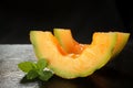 Two melon slices on black background Royalty Free Stock Photo