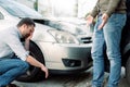 Two men arguing after a car accident on the road Royalty Free Stock Photo