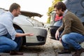 Two men arguing after a car accident on the road Royalty Free Stock Photo