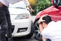 Two men arguing after a car accident Traffic Collision on the road. Royalty Free Stock Photo