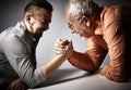 Two men arm wrestling competition. Royalty Free Stock Photo