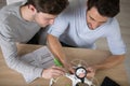 two men assembling drone at home Royalty Free Stock Photo