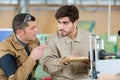two men assembling product in carpentry workshop Royalty Free Stock Photo