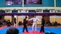 Two men athletes competes during the `Sukan Kombat 6 Penjuru` competition or fighting combat games.