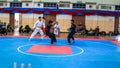 Two men athletes competes during the `Sukan Kombat 6 Penjuru` competition or fighting combat games.