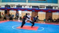 Two men athletes competes during the `Sukan Kombat 6 Penjuru` competition or fighting combat games.