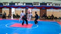 Two men athletes competes during the `Sukan Kombat 6 Penjuru` competition or fighting combat games.