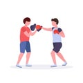 Two men boxers exercising thai boxing in red gloves couple fighters practicing at the fight club healthy lifestyle
