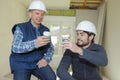 Two men builders coffee break Royalty Free Stock Photo