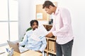 Two men business workers discussing working at office Royalty Free Stock Photo