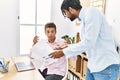 Two men business workers discussing working at office Royalty Free Stock Photo